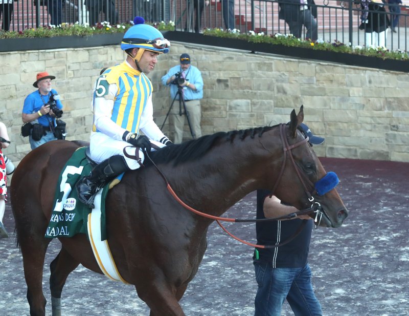 Jockey Joel Rosario and Nadal head into the winner's circle after winning the second division of the Arkansas Derby on May 2 at Oaklawn Racing Casino Resort. - Photo by Richard Rasmussen of The Sentinel-Record