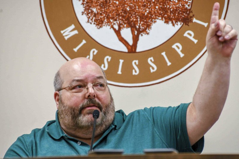 Petal, Miss., Mayor Hal Marx raises his hand and refuses to resign during a meeting at Petal City Hall on Thursday, May 28, 2020. The city's board of aldermen held a special meeting to call for Marx's resignation over comments he made about the death of Minneapolis man George Floyd at the hands of police.
