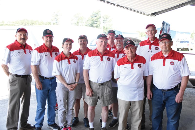 Members of the Bulldog Flight Formation team and their call names are, front row, from left, Angela “Scrubs” Palmer, Bill “Slatts” Schlatterer, Gerald “Bulldog” Loyd and Marvin “Smokey” Homsley; second row, Bill “Voodoo” Canino, Andy “Driller” Kitchens, Tommy “Vader” Palmer, Jerry “Homie” Homsley and Randal “Digger” Warren; and in back, Duane “Razor” Carroll.