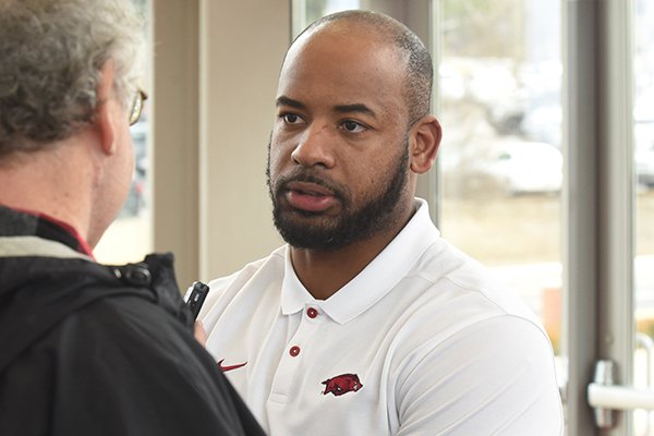 Arkansas assistant coach Sam Carter speaks with media members on Thursday, Feb. 6, 2020, in Fayetteville.