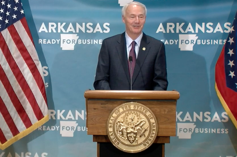 Arkansas Gov. Asa Hutchinson speaks to reporters in Little Rock on Friday in this screen grab of video provided by the governor's office. 