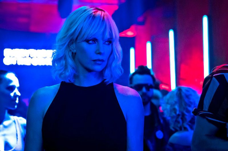 Charlize Theron plays Lorraine Broughton, an undercover MI6 agent sent to Berlin during the Cold War to investigate the murder of a fellow agent and recover a missing list of double agents, in David Leitch’s Atomic Blonde (2017).