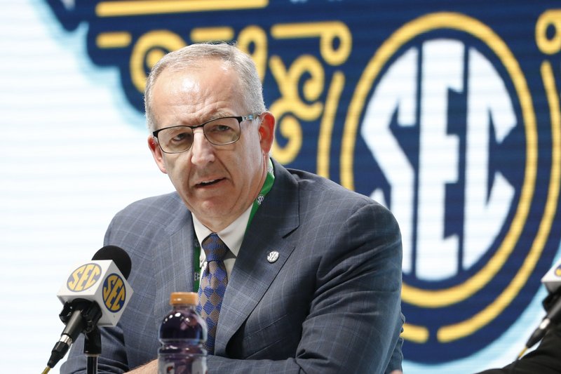 FILE - In this March 11, 2020, file photo, Southeastern Conference Commissioner Greg Sankey speaks at a press conference in Nashville, Tenn. The Power Five conferences spent $350,000 on lobbying in the first three months of 2020, more than they had previously spent in any full year, as part of a coordinated effort to influence Congress on legislation affecting the ability of college athletes to earn endorsement money. The Southeastern Conference was the biggest spender, hiring three lobbying firms and paying them a total of $140,000, according to lobbying disclosure forms reviewed by The Associated Press. (AP Photo/Mark Humphrey, File)