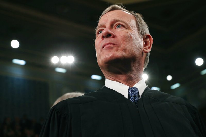 FILE - In this Tuesday, Feb. 4, 2020, file photo, Supreme Court Chief Justice John Roberts arrives before President Donald Trump delivers his State of the Union address to a joint session of Congress on Capitol Hill in Washington. A divided Supreme Court on Friday, May 29, 2020, rejected an emergency appeal by a California church that challenged state limits on attendance at worship services that have been imposed to contain the spread of the coronavirus. Over the dissent of the four more conservative justices, Roberts joined the court's four liberals in turning away a request from the South Bay United Pentecostal Church in Chula Vista, California, in the San Diego area. (Leah Millis/Pool via AP, File)