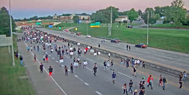 Demonstrators walk on Interstate 630 in Little Rock on Saturday, May 30, 2020, in this Arkansas Department of Transportation photo.