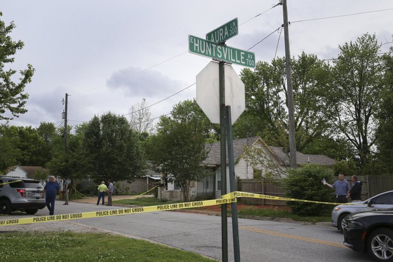 Investigators process the scene of an officer involved shooting, Thursday, May 28, 2020 at a house on Laura St. and Hunstville Ave in Springdale.
(NWA Democrat-Gazette/Charlie Kaijo)