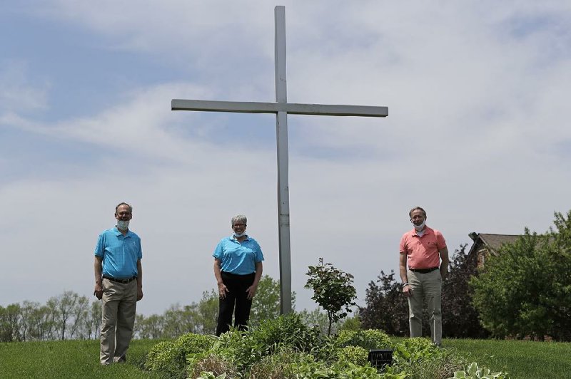 Senior Pastor Kendall Koenig (left), Associate Pastor Sharon Rogers (center) and PATH Manager Jared Skorburg pose for a photo at Light of Christ Lutheran Church in Algonquin, Ill., on Sunday.
(AP Photo/Nam Y. Huh)