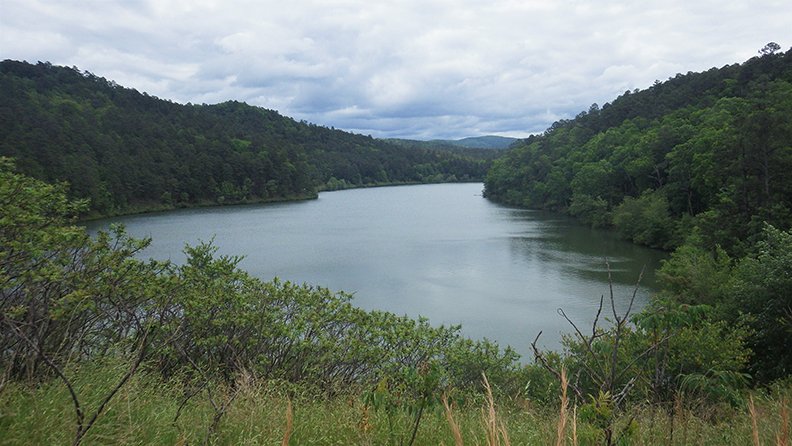Little Bear Creek Lake is nestled deep in a valley in Perry County, and provides those who manage to get their small crafts to the water's edge with beautiful scenery and the possibility of boating a reputable stringer of fish. - Photo by Corbet Deary of The Sentinel-Record