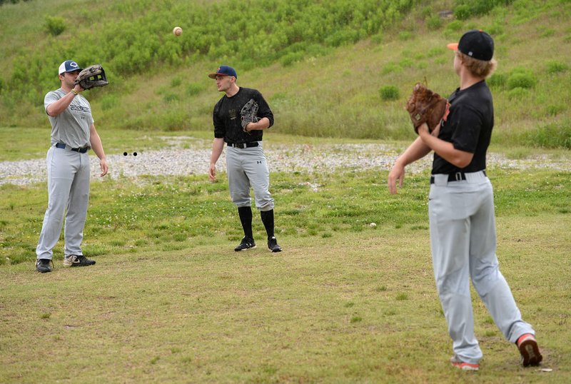 Coastal Carolina’s Tyler Johnson (from left) of Bentonville plays catch with Harding’s Sage White of Rogers and Connors State’s McK- aden Templeton, also of Rogers, at Perfect Timing in Springdale. Perfect Timing has hosted a baseball league for seniors who have graduated high school and others who have played in college. (NWA Democrat-Gazette/Andy Shupe) 