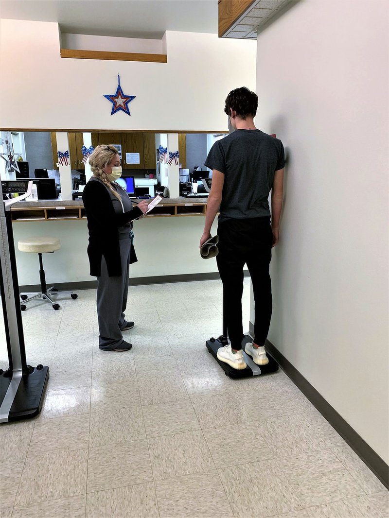 Certified nurse practitioner Jennifer Jones of the Orthopaedic Center of Hot Springs completes a sports physical for Lakeside athlete Dylan Dew. - Photo courtesy of Orthopaedic Center of Hot Springs