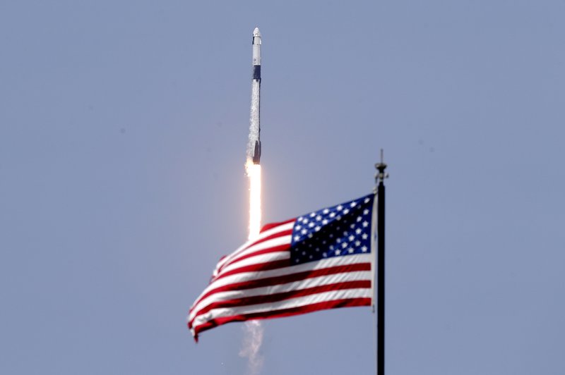 A SpaceX Falcon 9, with NASA astronauts Doug Hurley and Bob Behnken in the Dragon crew capsule, lifts off from Pad 39-A at the Kennedy Space Center in Cape Canaveral, Fla., Saturday, May 30, 2020. For the first time in nearly a decade, astronauts blasted towards orbit aboard an American rocket from American soil, a first for a private company.(AP Photo/John Raoux)