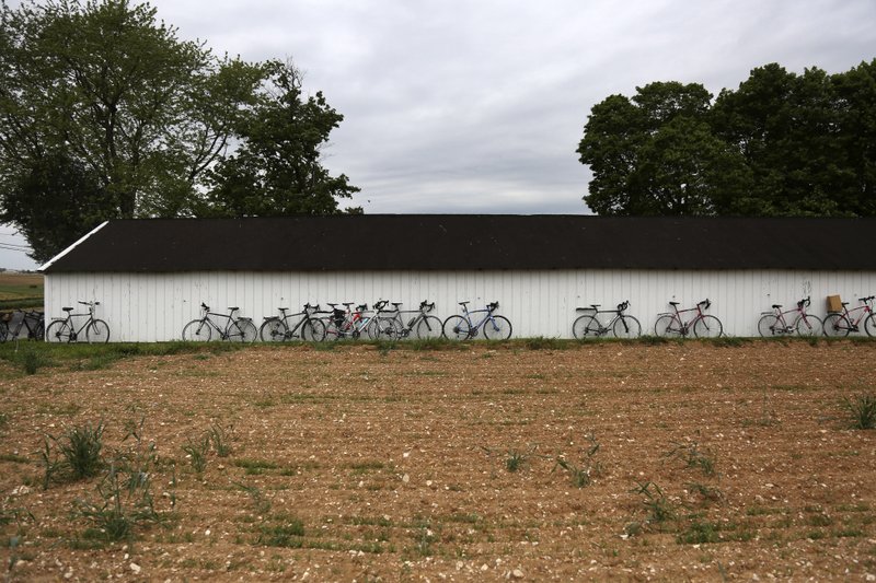 In this Sunday, May 17, 2020, photo, bicycles line the side of a shed near the Old Order Stauffer Mennonite Church as in-person service resumes for the first time in nearly two months, in New Holland, Pa. (AP Photo/Jessie Wardarski)