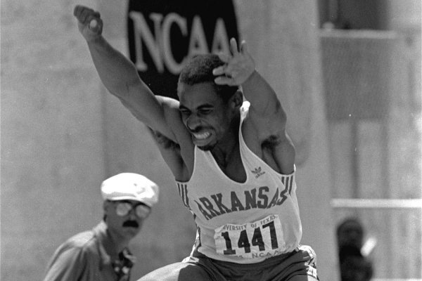 Mike Conley of the University of Arkansas goes through the air in the mens triple jump finals at the NCAA Outdoor Track and Field Championships at Austin, Texas Saturday, June 1, 1985. Conley made a jump of 57 feet 6 1/2 inches to win the event. It was the number 3 jump of all-time in the United States and a personal best for Conley. (AP Photo/Bill Belknap)