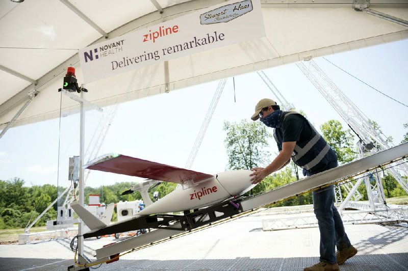 In this undated image provided by Novant Health, a preflight check is done on drone before a delivery from Novant Health Logistics Center in Kannapolis, N.C., to Novant Health Medical Center in Huntersville, N.C.
(Novant Health via AP/Davis Turner)