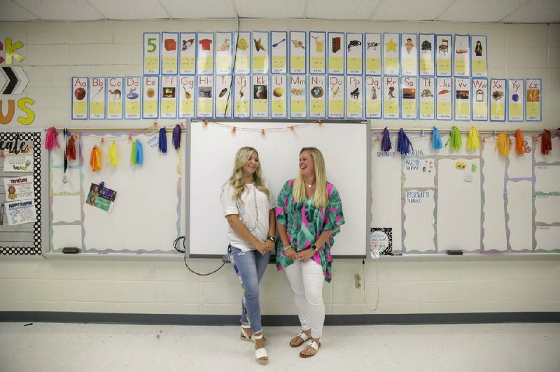 First-grade teachers Ellie Morgan (left) and Hannah Sprayberry said Thursday in Fort Oglethorpe, Ga., that they are taking nearly 5% pay cuts related to school pandemic-related budget woes.
(AP/Brynn Anderson)