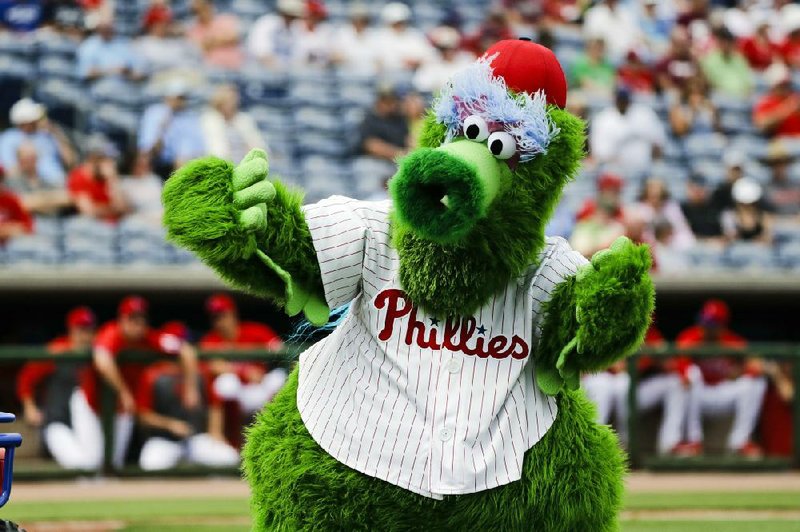 The Phillie Phanatic mascot performs before a spring training baseball game against the Toronto Blue Jays in Clearwater, Fla., in February. MLB wants to ban mascots — at least this season, should baseball resume — but mascots remained a staple of baseball games in Taiwan and the KBO League in South Korea. (AP/Frank Franklin II) 
