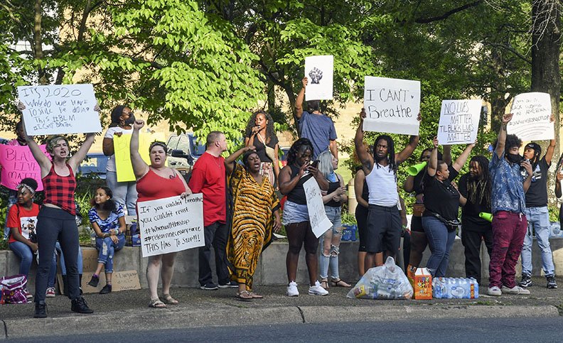 Members of the community gather at Hill Wheatley Plaza for a peaceful protest on Sunday after the death of George Floyd in Minneapolis sparked violent protests nationwide. - Photo by Grace Brown of The Sentinel-Record