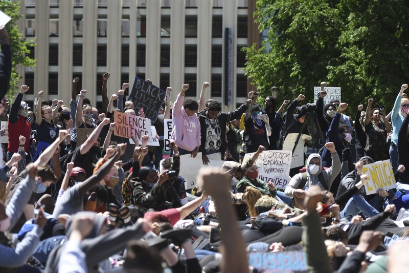 People rally against police violence, and in remembrance of those who have died at the hands of police, including George Floyd, Sunday at the State Capitol in downtown Lansing, Mich. - Matthew Dae Smith/Lansing State Journal via AP