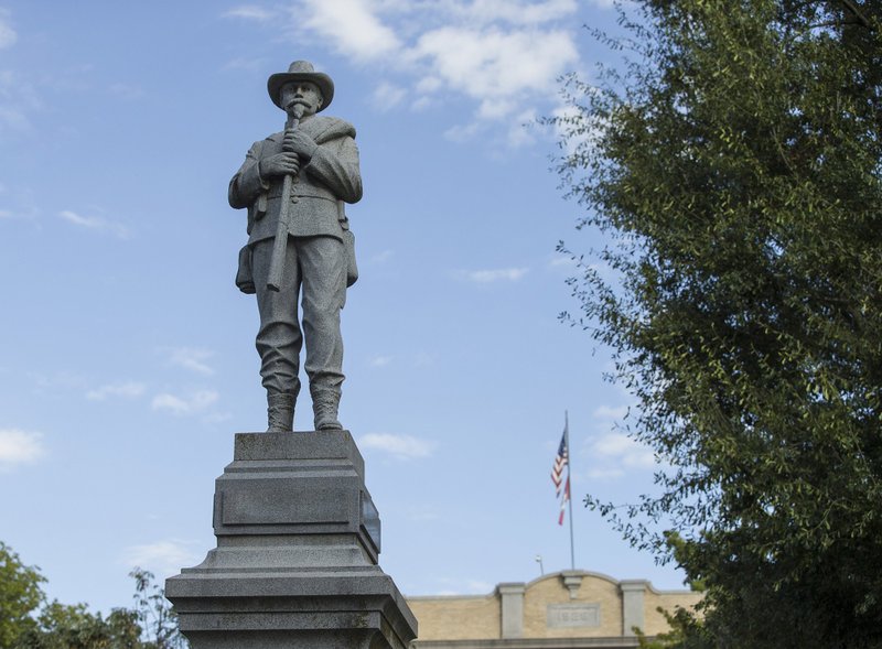 The Confederate soldier monument Wednesday, Sept. 25, 2019, on the Bentonville square. The lower part of the soldier's rifle is missing after the statue was vandalized. (NWA Democrat-Gazette/BEN GOFF)
