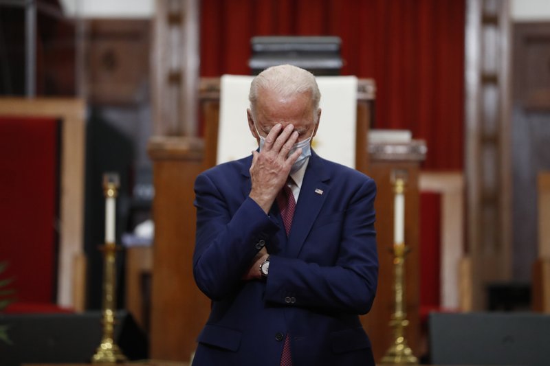 Democratic presidential candidate, former Vice President Joe Biden touches his face as he speaks to members of the clergy and community leaders at Bethel AME Church in Wilmington, Del., Monday, June 1, 2020. story.lead_photo.caption