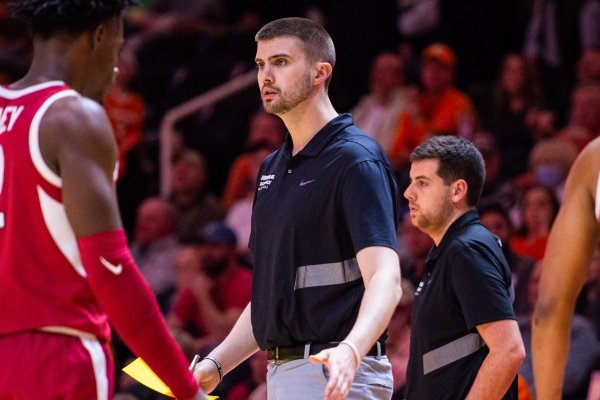 Arkansas Razorbacks recruiting coordinator Pat Ackerman is shown walking on the floor during a road game during the 2019-20 season.
