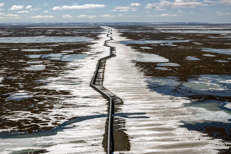 An oil pipeline stretches across the landscape outside Prudhoe Bay in North Slope Borough, Alaska. MUST CREDIT: Washington Post photo by Bonnie Jo Mount