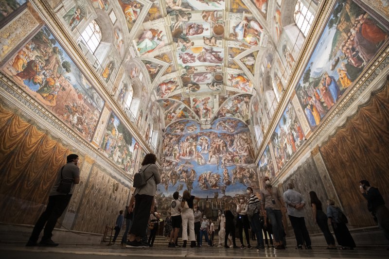 Visitors admire the Sistine Chapel on Monday as the Vatican Museums reopen after a three-month shutdown to help slow the spread of the coronavirus. More photos at arkansasonline.com/62virus/. (AP/Alessandra Tarantino) 