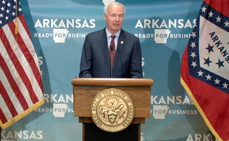 In this file photo Arkansas Gov. Asa Hutchinson speaks to reporters at the Capitol in Little Rock in this screen grab of video provided by the governor's office. 