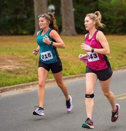 From left to right, Carrie Jackson and Leslie Darden run the MusicFest 10k in El Dorado.