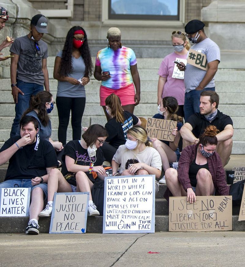 People from across Arkansas gather to protest Monday outside Little Rock City Hall. More photos at arkansasonline.com/62lrprotest/. (Arkansas Democrat-Gazette/Stephen Swofford) 