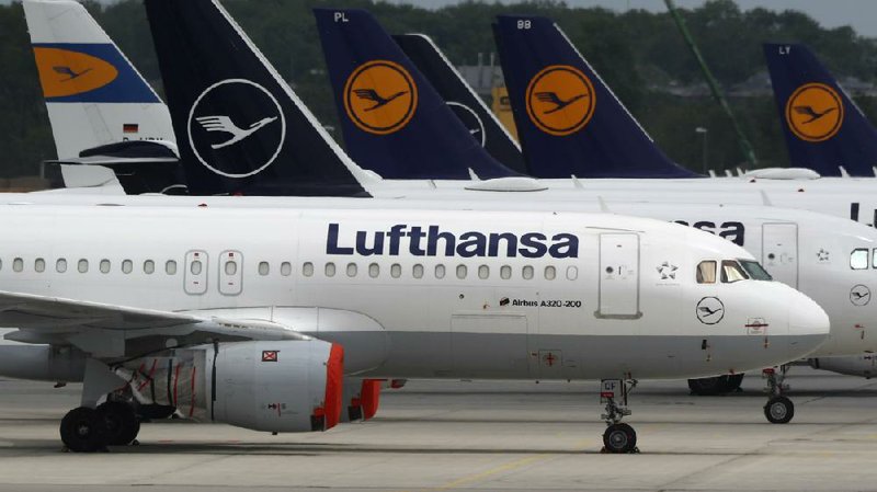 Lufthansa Jets are parked last week at the airport in Munich. (AP/Matthias Schrader)