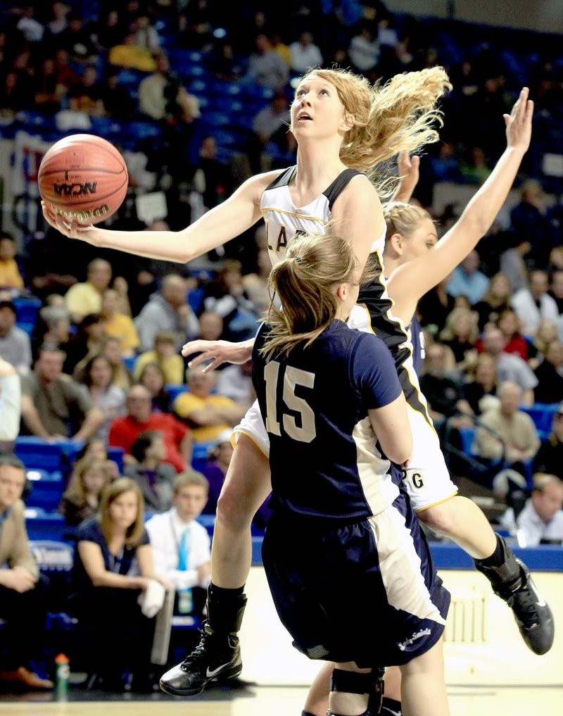 Arkansas Democrat-Gazette/fSTATON BREIDENTHAL Prairie Grove's Kendra Coyle, shown driving to the basket against Shiloh Christian's Jessica Parks on Thursday, March 10, 2011 during a 4A state championship game at Hot Springs, was named MVP a year earlier as part of Prairie Grove's 2010 state championship girls basketball team which wasn't easy during a 35-32 semifinal win against Lonoke.