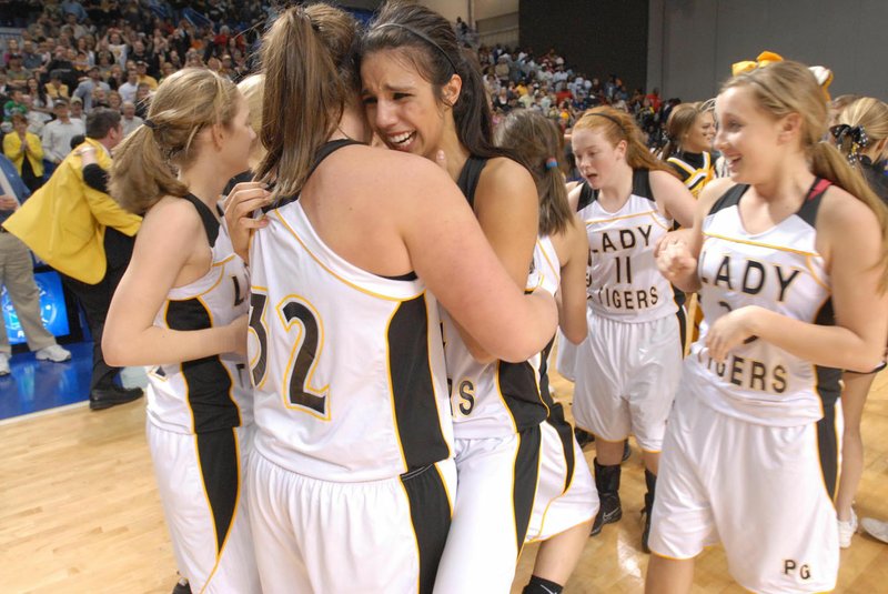 Arkansas Democrat-Gazette/KAREN E. SEGRAVE Prairie Grove's Julie Rutherford (facing) celebrates with teammate Alex Myers (No. 32) in their 59-56 victory over Star City in the class 4A girls state championship held Thursday, March 11, 2010 at the Summit Arena in Hot Springs. That championship season is the top story of the Decade: 2010-2019 for Prairie Grove as selected by the Enterprise-Leader.