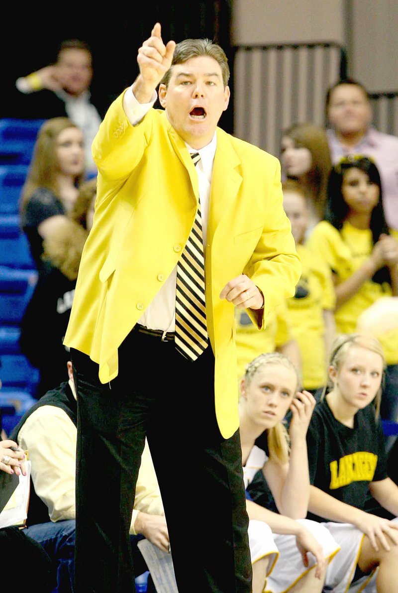 Arkansas Democrat-Gazette/fSTATON BREIDENTHAL Prairie Grove coach Kevin Froud yells instructions to his team Thursday during the 4A state championship game against Shiloh Christian March 10, 2011 in Hot Springs. The previous year Froud guided the Lady Tigers to their first girls basketball state championship with a 59-56 win in the same arena on Thursday, March 11, 2010 over Star City. During the 2010 state championship run Froud led Prairie Grove past Shiloh Christian to the tune of a 52-30 win in the 4A North Regional at Clarksville.