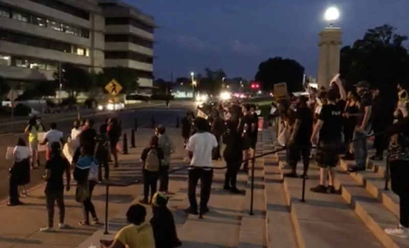 Protesters are seen at the Capitol in Little Rock on Wednesday night after the city's 8 p.m. curfew took effect.