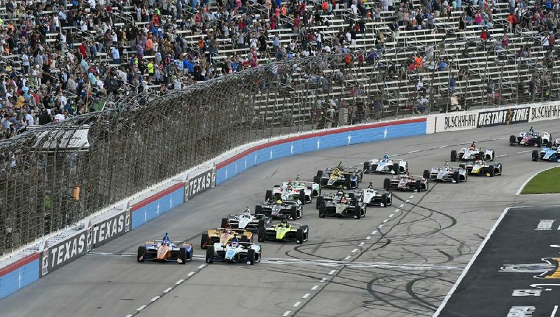 Drivers jockey for position at the start of an IndyCar race at Texas Motor Speedway in Fort Worth in 2019. The IndyCar Series is getting ready for an all-in-one-day season opener in Texas, more than 21⁄2 months after drivers were set to roll on the streets of St. Petersburg, Fla. The pandemic-delayed season is now set to open Saturday. 
(AP file photo) 