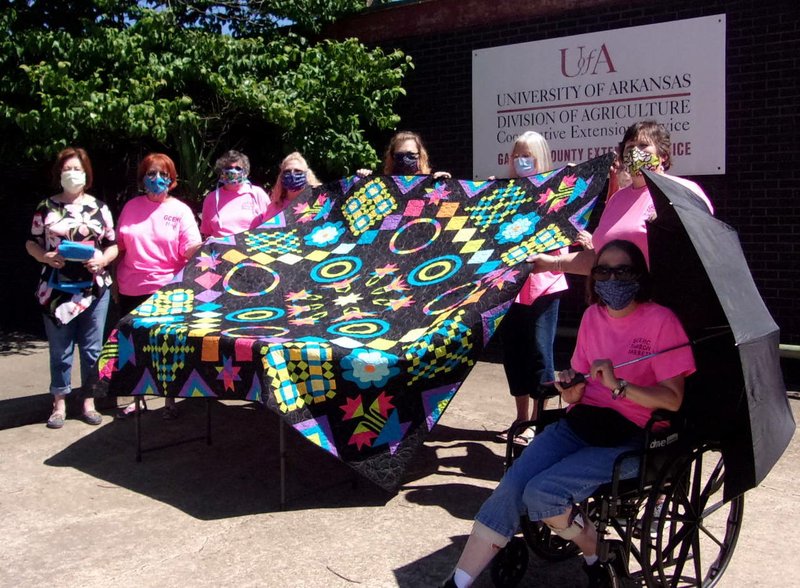 The Crazy Quilters Club of Garland County Extension Homemakers recently drew the winning ticket for the Relay for Life Quilt. Berta Hinajasn, of Hot Springs, was this year's winner. - Submitted photo