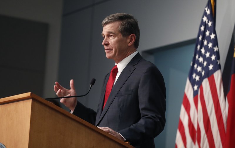 North Carolina Gov. Roy Cooper speaks during a briefing at the Emergency Operations Center in Raleigh, N.C., Tuesday, June 2, 2020. (Ethan Hyman/The News & Observer via AP)