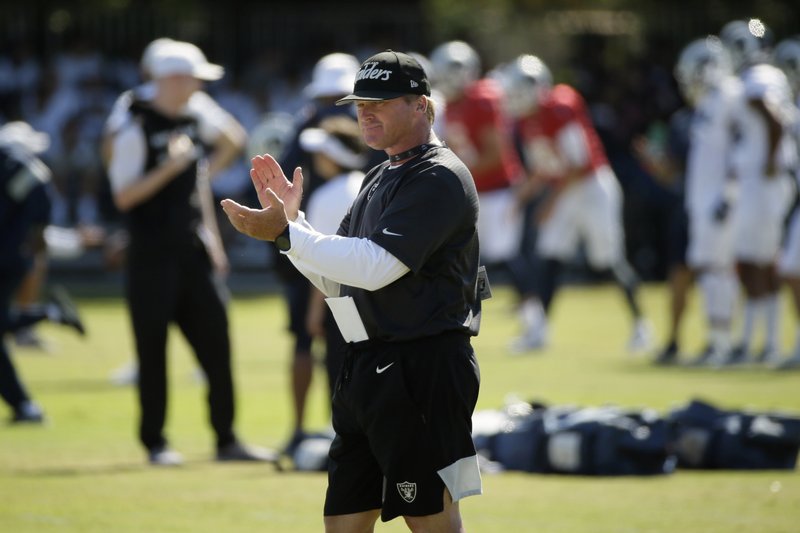 In this Aug. 8, 2019, file photo, Raiders head coach Jon Gruden claps during a combined NFL football training camp with the Rams, in Napa, Calif. Commissioner Roger Goodell told the 32 NFL clubs on Thursday, June 4, 2020, that coaching staffs are allowed to return to team facilities starting Friday.
 (AP Photo/Eric Risberg, File)