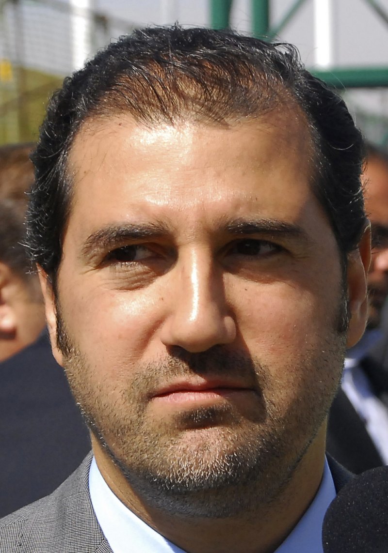 In this April 24, 2010, file photo, Rami Makhlouf, a cousin of Syrian President Bashar Assad and one of that country's wealthiest businessmen, attends an event to inaugurate a hotel project in Damascus, Syria. The unprecedented public crackdown on Syria's wealthiest businessman, a close cousin of Bashar Assad, comes as the embattled president seeks to consolidate power and rein in war profiteers. Syria is preparing for a new phase of economic hardship and U.S.-led sanctions that some say might be more difficult to weather than war. - AP Photo