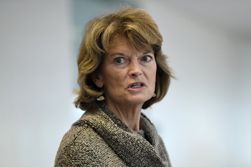 FILE - In this March 19, 2020, file photo Sen. Lisa Murkowski, R-Alaska, talks with reporters following a Republican policy lunch on Capitol Hill in Washington. (AP Photo/Susan Walsh, File)