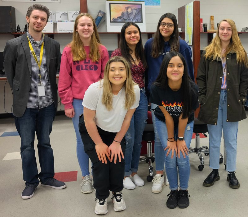 A team of students from Springdale's George Junior High School made a virtual reality experience to help amputees who suffer from phantom limb pain. Their project placed among the best in the nation in the 2020 Samsung Solve for Tomorrow Contest. George Junior High teacher Robert Beard is pictured with team members (front row from left) Jayde Ward and Vanessa Colin; (back row from left) Abigail Eggers, Itzel Villanueva, Maricarmen Medrano and Madison Bartholomew. (Courtesy Photo/Robert Beard)