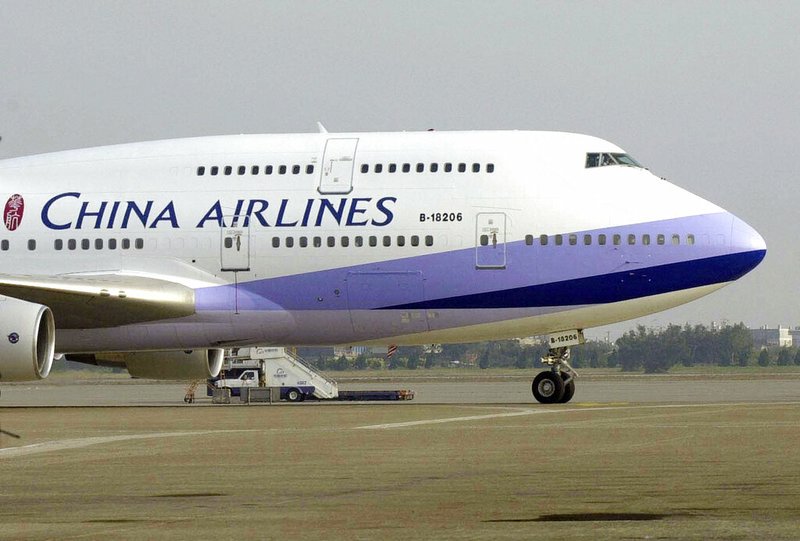 A China Airlines Boeing 747-400 sits on the tarmac at the Chiang Kai-shek International airport in Taoyuan, Taiwan, in this Jan. 26, 2003, file photo.