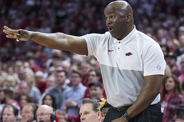 Arkansas assistant basketball coach Chris Crutchfield motions toward the court during a game against Kentucky on Saturday, Jan. 18, 2020, in Fayetteville. 