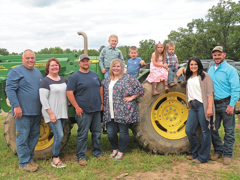 The Stevie Duvall family of Atkins is the 2020 Pope County Farm Family of the Year. Members of the family are, front row, from left, Stevie Duvall, Tamara Duvall, Mitchell Moore, Jennifer Duvall Moore, Paige Duvall and Matt Duvall; and back row, Tucker Moore, Tate Moore, Graylee Duvall and Grady Duvall.