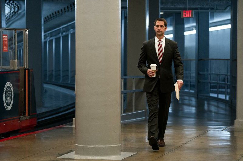 Sen. Tom Cotton heads to a meeting Wednesday at the Capitol. Cotton’s opinion piece in The New York Times defending the Insurrection Act as a way to quell rioting met heavy criticism from Times staff members, with one calling it “inflammatory and endorsing military occupation as if the Constitution doesn’t exist.”
(The New York Times/Anna Moneymaker)