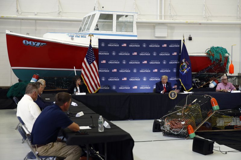 President Donald Trump speaks during a roundtable discussion with commercial fishermen at Bangor International Airport in Bangor, Maine, Friday, June 5, 2020. (AP Photo/Patrick Semansky)