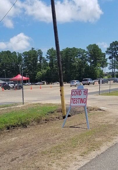 A sign directs residents to a free, drive-through COVID-19 testing event offered by the Arkansas Department of Health in cooperation with the Union County Health Unit Saturday, June 6 at the Union County Fairgrounds in El Dorado.. (Caitlan Butler/News-Times)