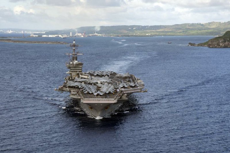 The aircraft carrier USS Theodore Roosevelt departs Apra Harbor in Guam on Thursday, 10 weeks after a coronavirus outbreak sidelined the vessel.
(AP/U.S. Navy/Mass Communication Specialist Seaman Kaylianna Genier)