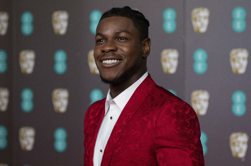 John Boyega poses for photographers upon arrival at the Bafta Film Awards, in central London, Sunday, Feb. 2 2020. (Photo by Vianney Le Caer/Invision/AP)
